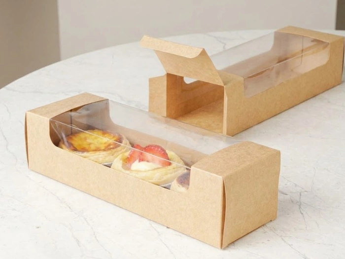 ایده بسته بندی کیک خانگی برای فروش داخل جعبه مقوایی طلق‌دار مناسب تارت و شیرینی